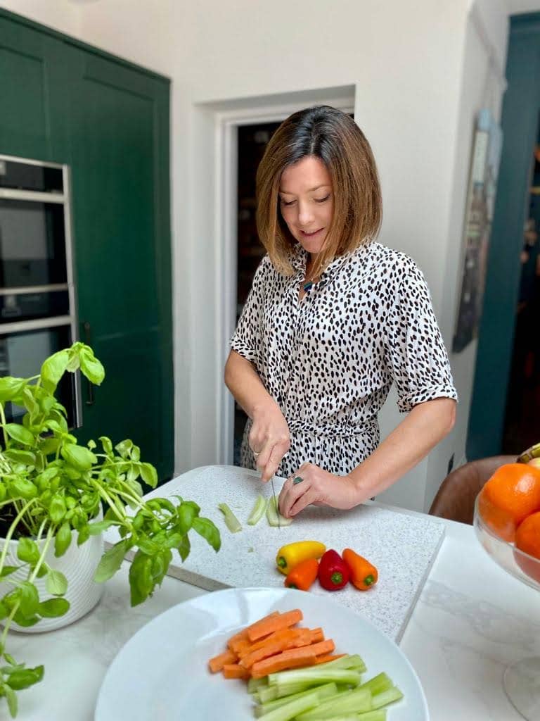 NutriSian nutritionist Sian cutting vegetables in the kitchen